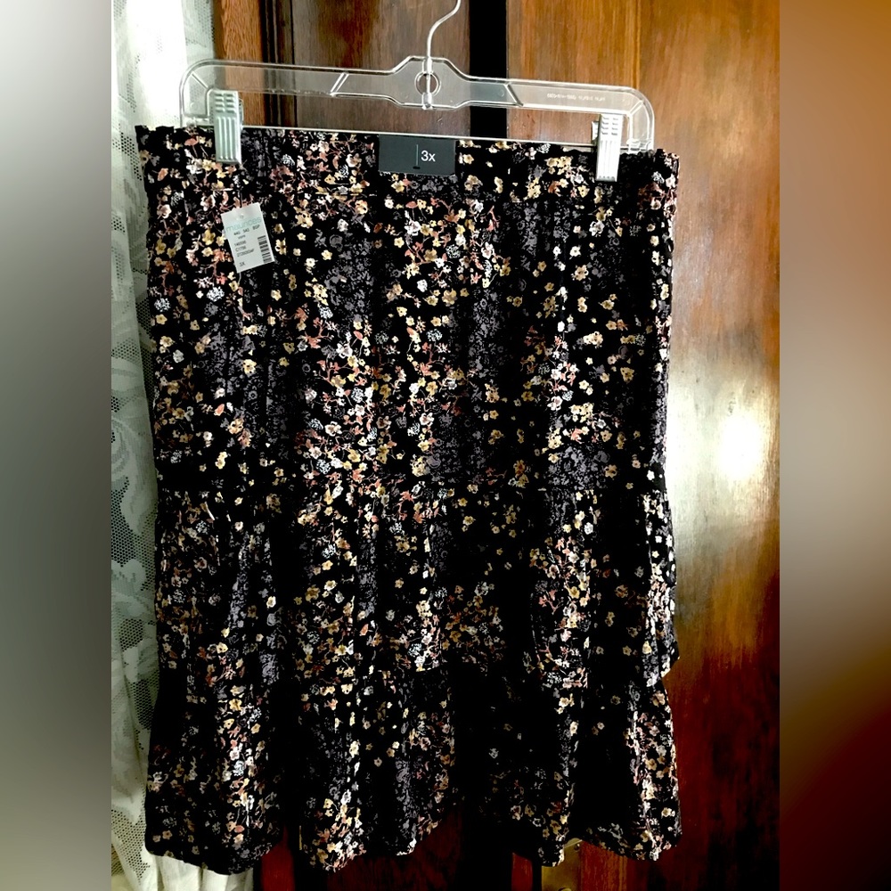 A black floral ruffle skirt